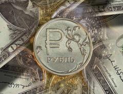 К концу года курс рубля может достигнуть 70-72 рублей за доллар